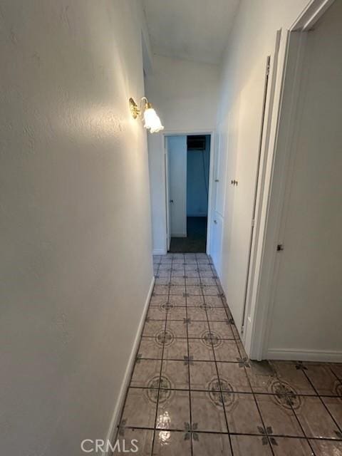 8960 Indiana Ave, Riverside, CA 92503 - hallway featuring light tile patterned floors and baseboards