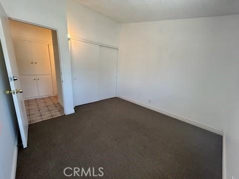 8960 Indiana Ave, Riverside, CA 92503 - unfurnished bedroom featuring carpet flooring and a closet