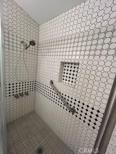 8960 Indiana Ave, Riverside, CA 92503 - full bath with tiled shower and tile patterned flooring