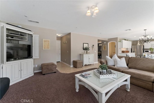 5549 Pine Ave, Chino Hills, CA 91709 - living room featuring a chandelier, light colored carpet, arched walkways, and baseboards