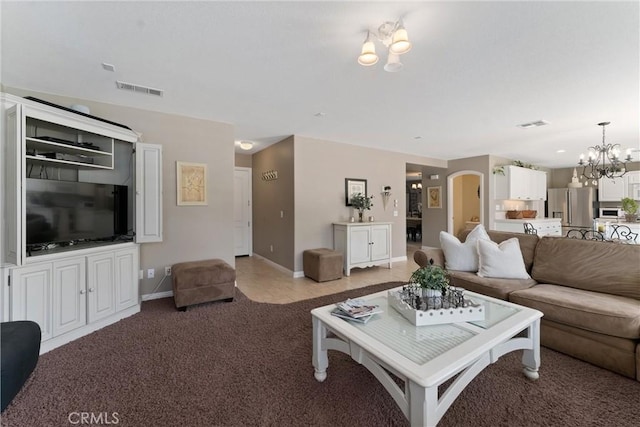 5549 Pine Ave, Chino Hills, CA 91709 - living area with a chandelier, light colored carpet, and arched walkways