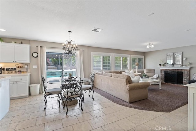 5549 Pine Ave, Chino Hills, CA 91709 - dining room with plenty of natural light, a chandelier, and a fireplace