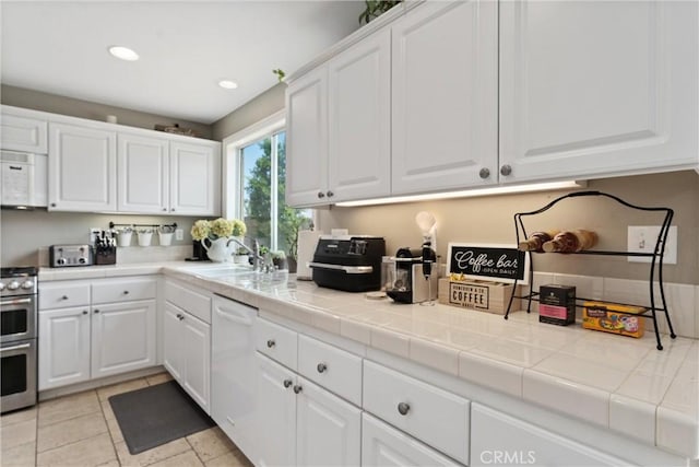 5549 Pine Ave, Chino Hills, CA 91709 - kitchen with white appliances, a sink, white cabinets, recessed lighting, and tile counters