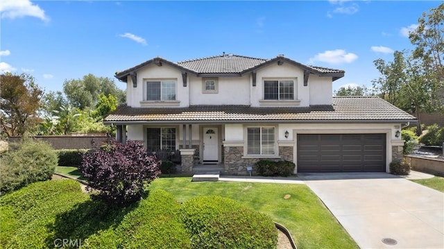 5549 Pine Ave, Chino Hills, CA 91709 - view of front of house featuring concrete driveway, stucco siding, a tile roof, and stone siding