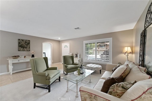 5549 Pine Ave, Chino Hills, CA 91709 - living area featuring arched walkways, baseboards, and light tile patterned floors