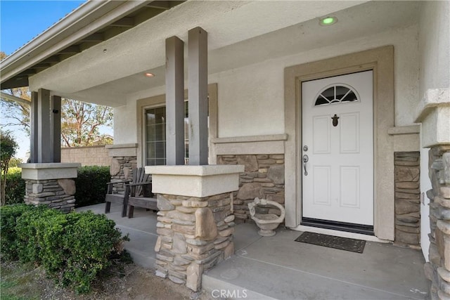 5549 Pine Ave, Chino Hills, CA 91709 - view of exterior entry with stone siding, covered porch, and stucco siding