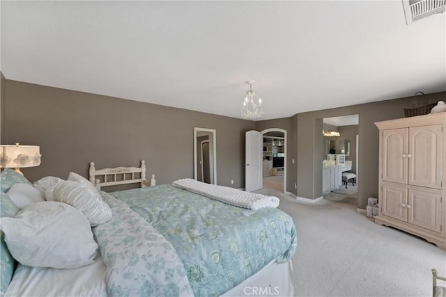 5549 Pine Ave, Chino Hills, CA 91709 - bedroom featuring light carpet, a chandelier, arched walkways, baseboards, and ensuite bath