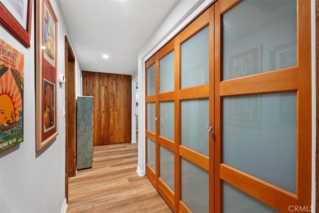 21372 Sand Dollar Ln, Huntington Beach, CA 92646 - hall with wood finished floors, recessed lighting, baseboards, and french doors