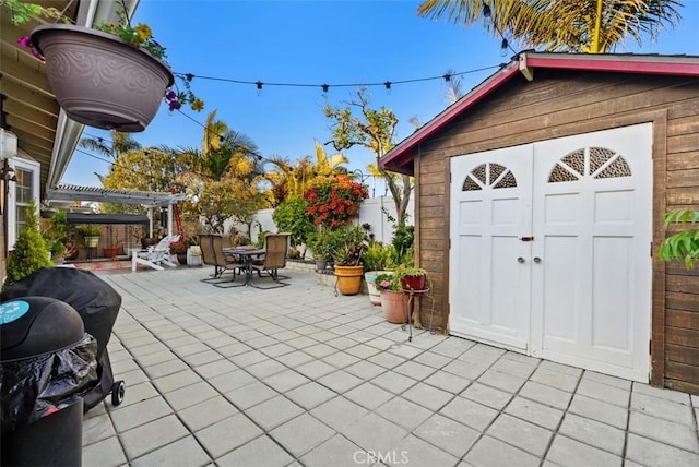 21372 Sand Dollar Ln, Huntington Beach, CA 92646 - view of patio featuring outdoor dining area and an outbuilding