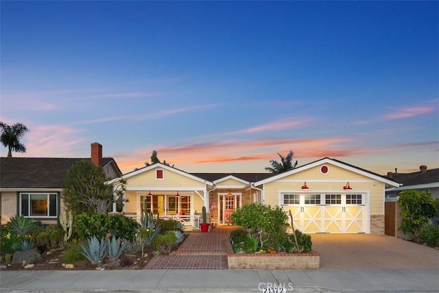 21372 Sand Dollar Ln, Huntington Beach, CA 92646 - ranch-style house with a garage, covered porch, and driveway