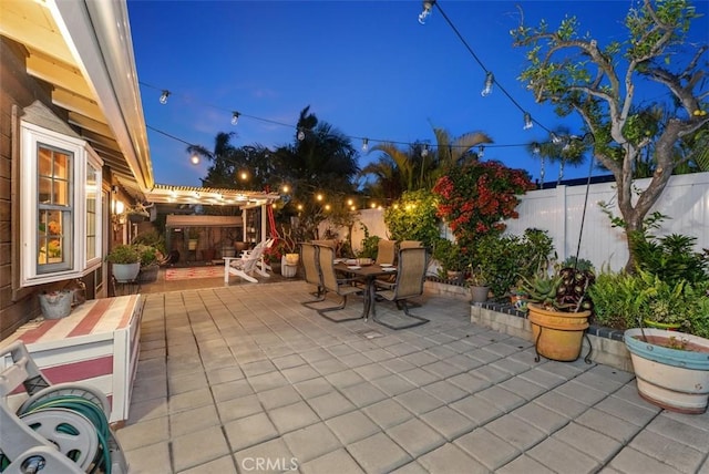 21372 Sand Dollar Ln, Huntington Beach, CA 92646 - view of patio with outdoor dining area, a fenced backyard, and a pergola