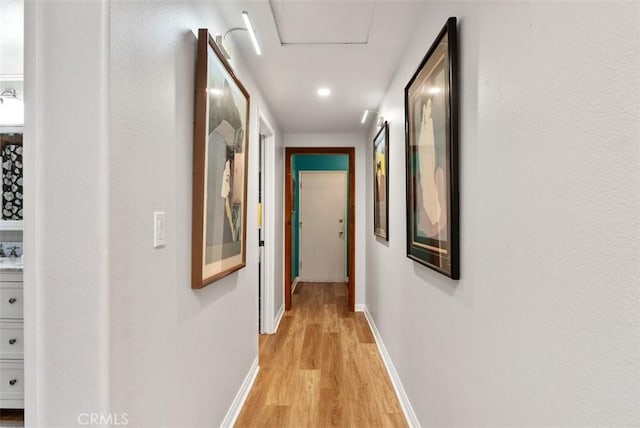 21372 Sand Dollar Ln, Huntington Beach, CA 92646 - corridor featuring light wood-type flooring, baseboards, and recessed lighting