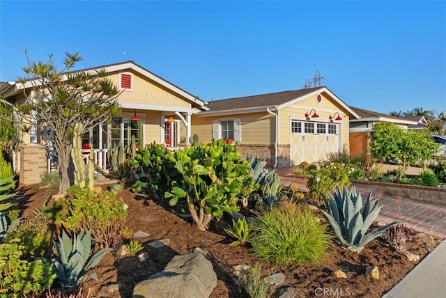 21372 Sand Dollar Ln, Huntington Beach, CA 92646 - view of front facade featuring an attached garage and brick siding