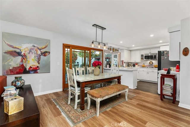 21372 Sand Dollar Ln, Huntington Beach, CA 92646 - dining room featuring wood finished floors, baseboards, and recessed lighting
