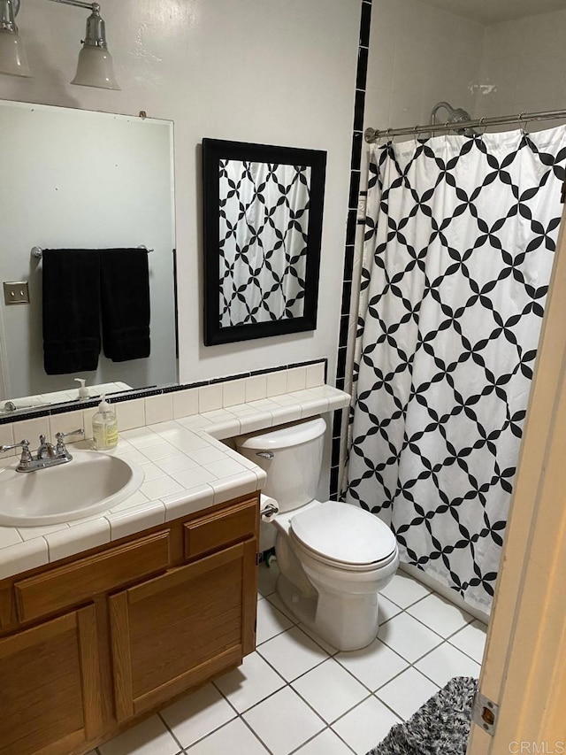 6172 Tamilynn St, San Diego, CA 92122 - full bathroom with toilet, vanity, tile patterned flooring, and curtained shower
