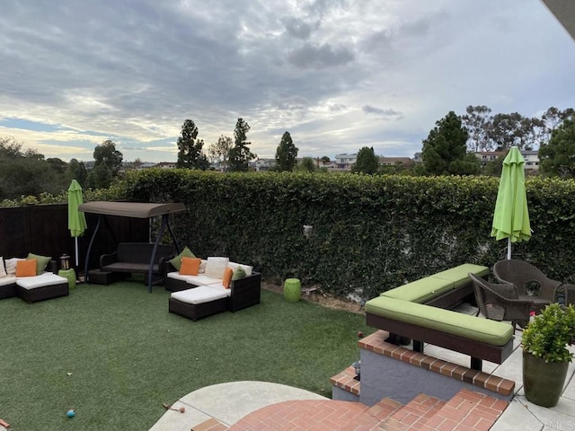 6172 Tamilynn St, San Diego, CA 92122 - fenced backyard with an outdoor living space and a patio area