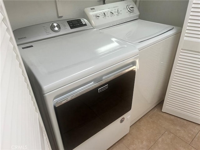 22728 Madrid Dr, Lake Forest, CA 92630 - washroom with washing machine and clothes dryer and light tile patterned floors