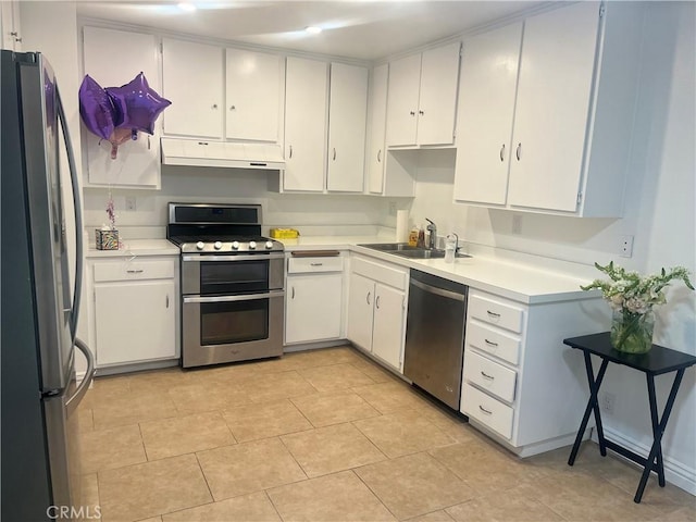 22728 Madrid Dr, Lake Forest, CA 92630 - kitchen featuring appliances with stainless steel finishes, a sink, under cabinet range hood, and white cabinetry