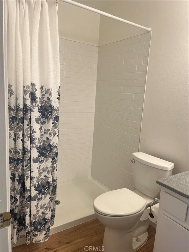 22728 Madrid Dr, Lake Forest, CA 92630 - full bath featuring wood finished floors, toilet, a stall shower, and vanity