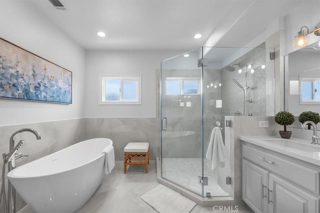 1817 Clark Ln Unit B, Redondo Beach, CA 90278 - bathroom with vanity, a shower stall, tile walls, a soaking tub, and recessed lighting