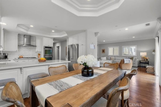 1817 Clark Ln Unit B, Redondo Beach, CA 90278 - dining space with a tray ceiling, crown molding, recessed lighting, and wood finished floors
