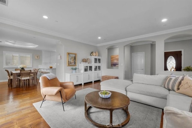 1817 Clark Ln Unit B, Redondo Beach, CA 90278 - living area with light wood-style floors, plenty of natural light, recessed lighting, arched walkways, and ornamental molding