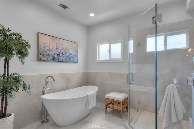 1817 Clark Ln Unit B, Redondo Beach, CA 90278 - bathroom with tile walls, a stall shower, a freestanding tub, a wainscoted wall, and recessed lighting