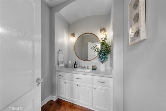 1817 Clark Ln Unit B, Redondo Beach, CA 90278 - bathroom with vanity, baseboards, wood finished floors, and lofted ceiling