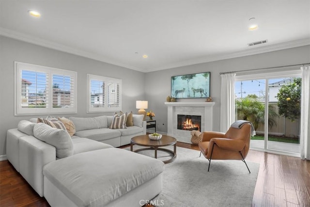 1817 Clark Ln Unit B, Redondo Beach, CA 90278 - living area featuring ornamental molding, a glass covered fireplace, dark wood-style floors, recessed lighting, and baseboards