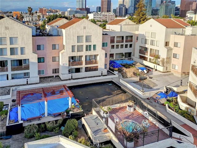 1118 Valencia St Unit 216, Los Angeles, CA 90015 - drone / aerial view of a pool and a skyline view