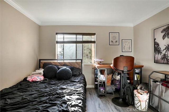 1118 Valencia St Unit 216, Los Angeles, CA 90015 - bedroom featuring wood finished floors, ornamental molding, and baseboards