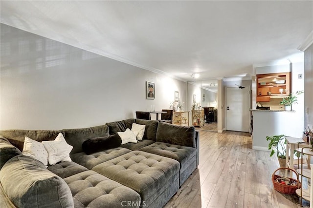1118 Valencia St Unit 216, Los Angeles, CA 90015 - living area featuring ornamental molding and light wood finished floors
