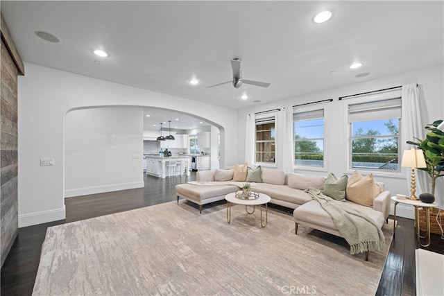 12 Via Alcamo, San Clemente, CA 92673 - living room with arched walkways, ceiling fan, dark wood-type flooring, recessed lighting, and baseboards