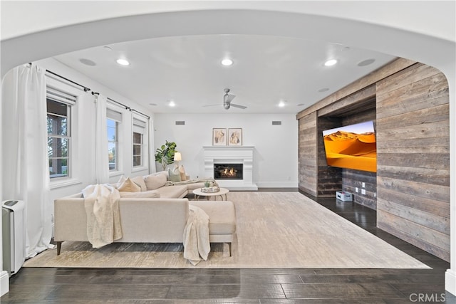 12 Via Alcamo, San Clemente, CA 92673 - living room featuring a ceiling fan, recessed lighting, an accent wall, a glass covered fireplace, and wooden walls