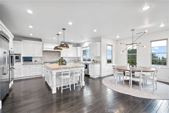 12 Via Alcamo, San Clemente, CA 92673 - kitchen featuring appliances with stainless steel finishes, a center island, white cabinets, baseboards, and recessed lighting