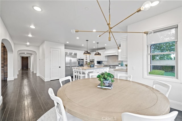 12 Via Alcamo, San Clemente, CA 92673 - dining area with arched walkways, recessed lighting, a chandelier, dark wood finished floors, and baseboards