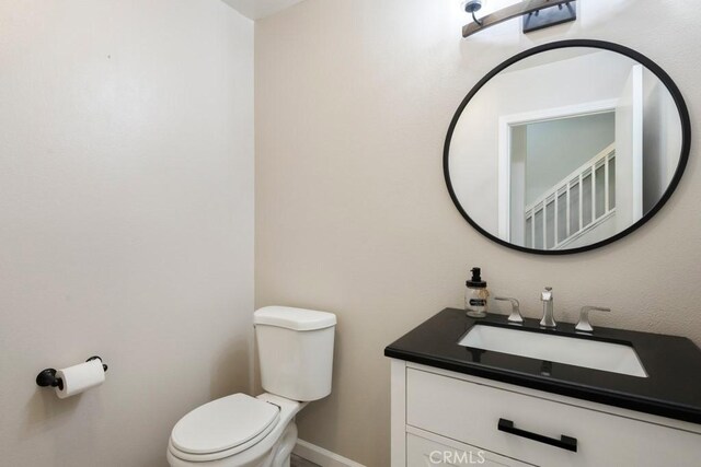 5354 Wrangler Dr, Fontana, CA 92336 - half bathroom featuring toilet and vanity