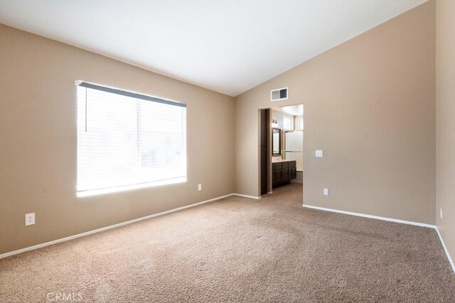 5354 Wrangler Dr, Fontana, CA 92336 - unfurnished room featuring vaulted ceiling and light carpet