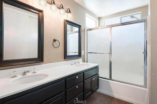 5354 Wrangler Dr, Fontana, CA 92336 - bathroom with double vanity and bath / shower combo with glass door