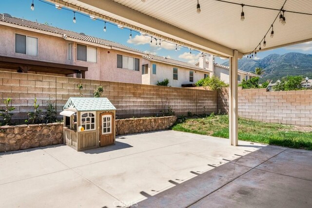5354 Wrangler Dr, Fontana, CA 92336 - view of patio with a mountain view