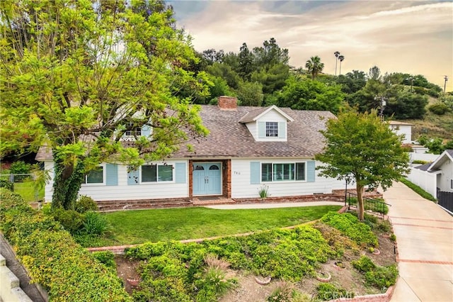 780 Brown Sage Dr, Glendora, CA 91741 - cape cod house featuring a chimney and roof with shingles