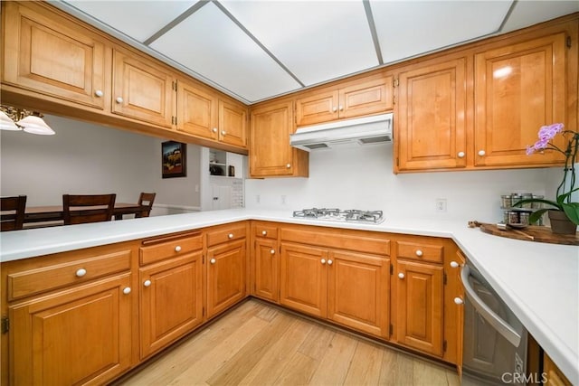 780 Brown Sage Dr, Glendora, CA 91741 - kitchen with under cabinet range hood, white gas stovetop, and brown cabinets