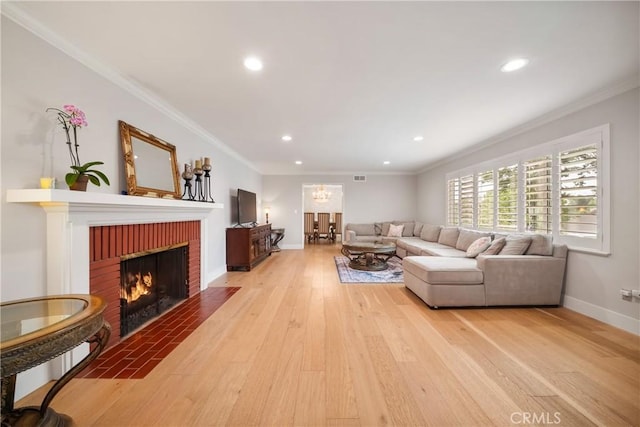 780 Brown Sage Dr, Glendora, CA 91741 - living area with light wood-style flooring, a fireplace, recessed lighting, ornamental molding, and a chandelier