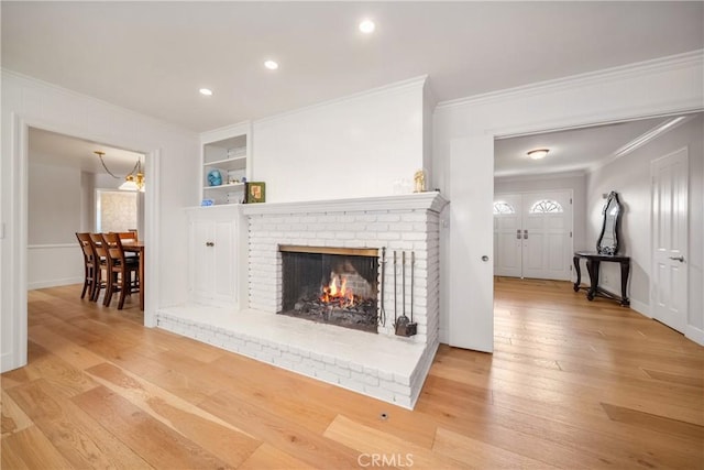 780 Brown Sage Dr, Glendora, CA 91741 - living room featuring ornamental molding, hardwood / wood-style flooring, a fireplace, recessed lighting, and built in features