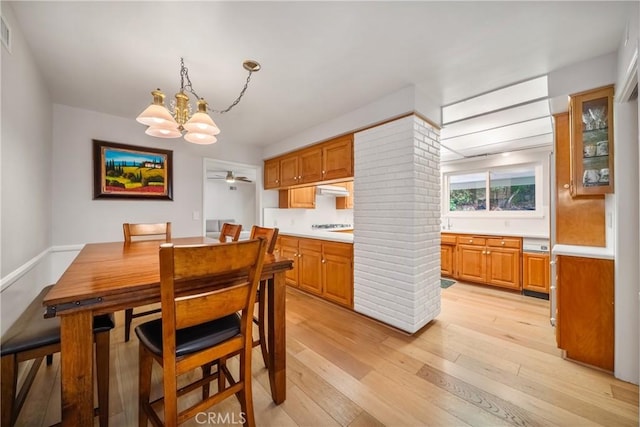 780 Brown Sage Dr, Glendora, CA 91741 - dining area with a chandelier, light wood-type flooring, and a ceiling fan