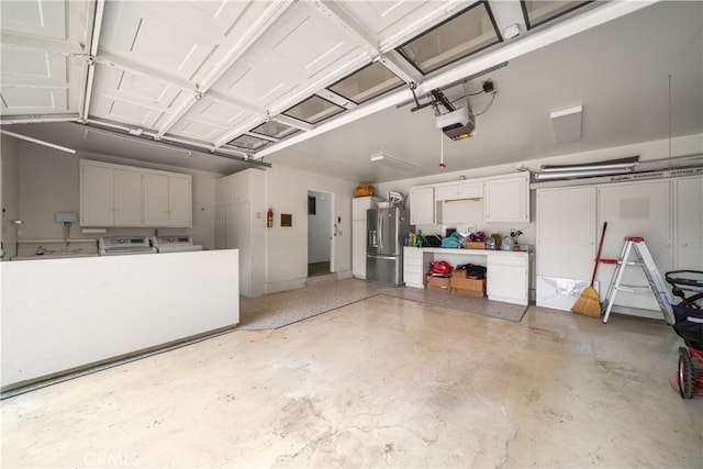780 Brown Sage Dr, Glendora, CA 91741 - garage featuring washer and dryer, stainless steel fridge, and a garage door opener