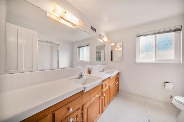 780 Brown Sage Dr, Glendora, CA 91741 - bathroom with double vanity, toilet, a shower with door, and baseboards