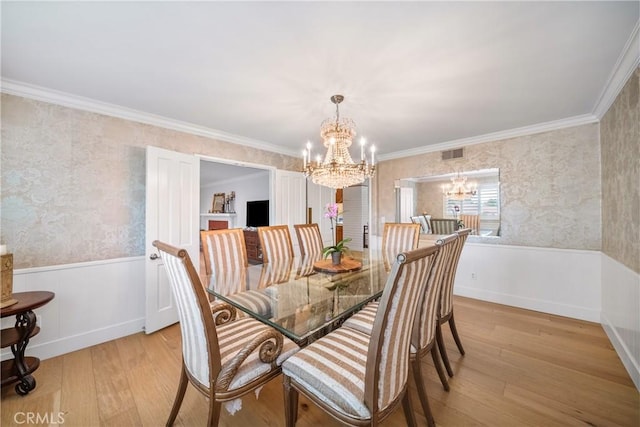 780 Brown Sage Dr, Glendora, CA 91741 - dining area with a chandelier, light wood finished floors, wainscoting, wallpapered walls, and crown molding