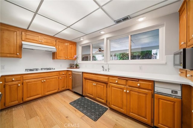 780 Brown Sage Dr, Glendora, CA 91741 - kitchen with stainless steel appliances, under cabinet range hood, brown cabinetry, and recessed lighting