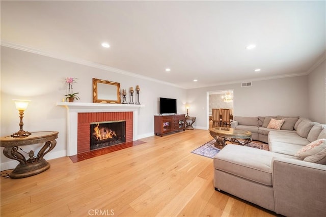 780 Brown Sage Dr, Glendora, CA 91741 - living room with light wood-style flooring, recessed lighting, a fireplace, ornamental molding, and baseboards